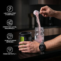 Person pouring a NUTRAHOUSE electrolytes into a water bottle with product features listed on the left.