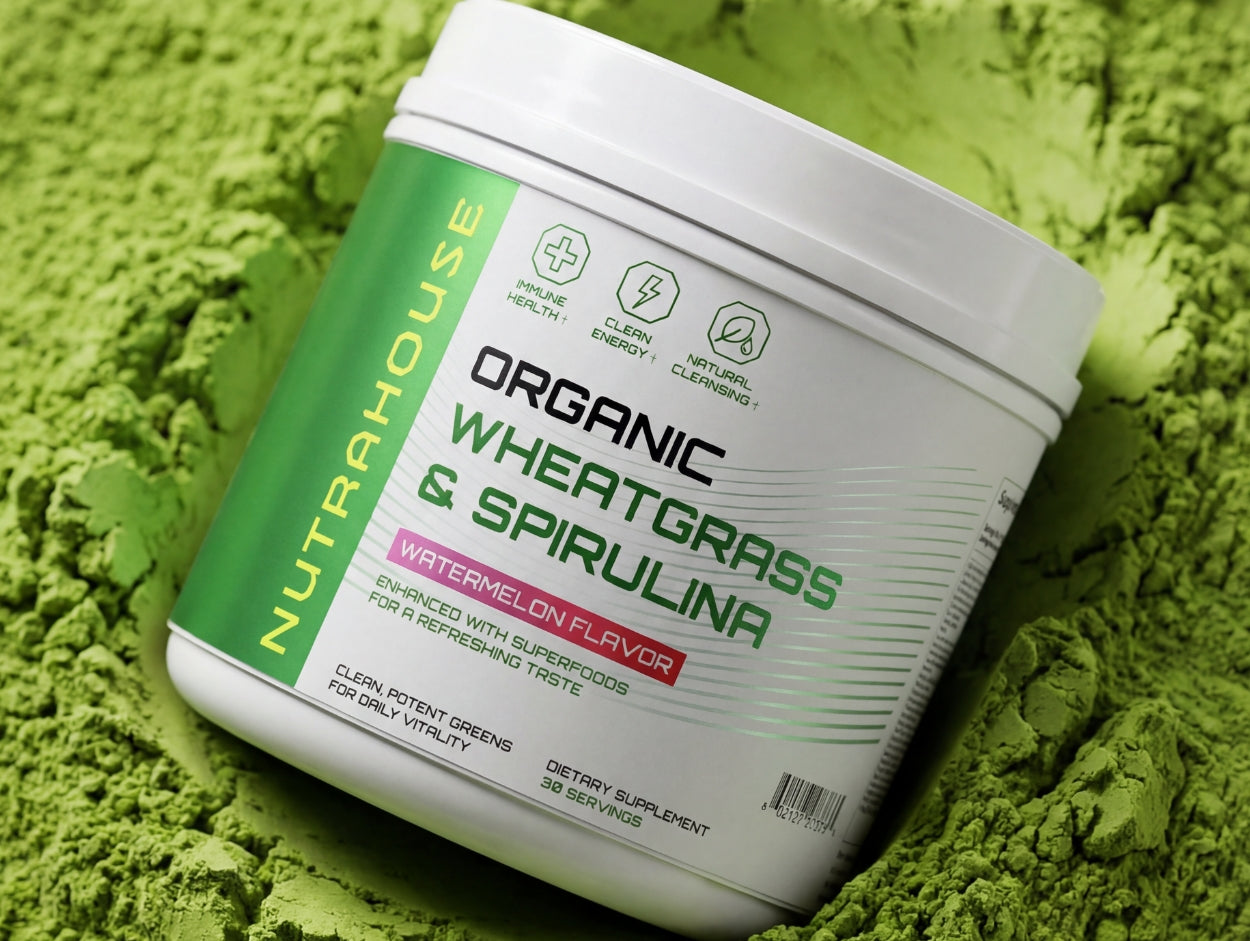A tub of NUTRAHOUSE Wheatgrass & Spirulina greens powder, with wheatgrass powder in the background.