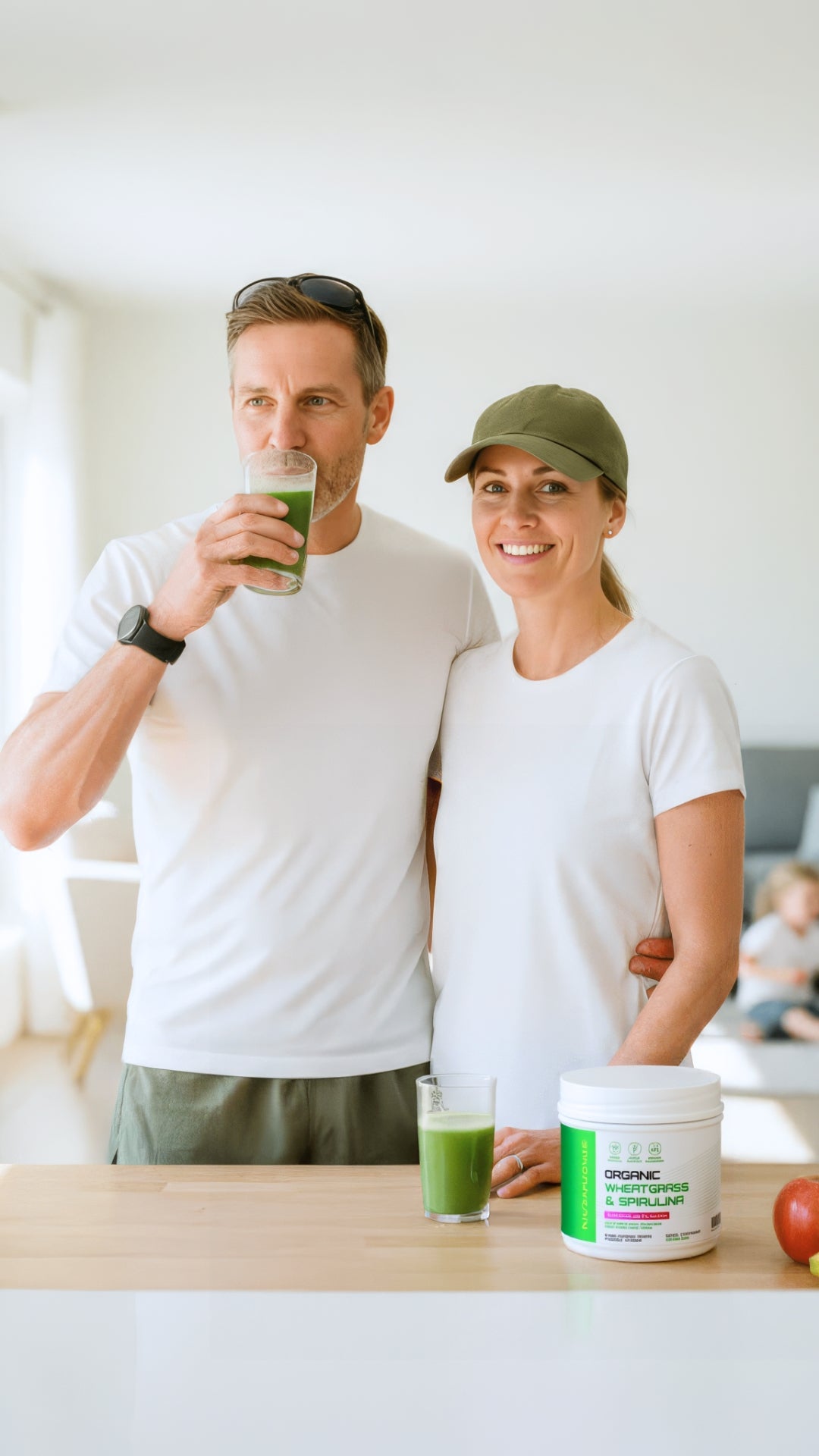A couple drinking their NUTRAHOUSE wheatgrass greens