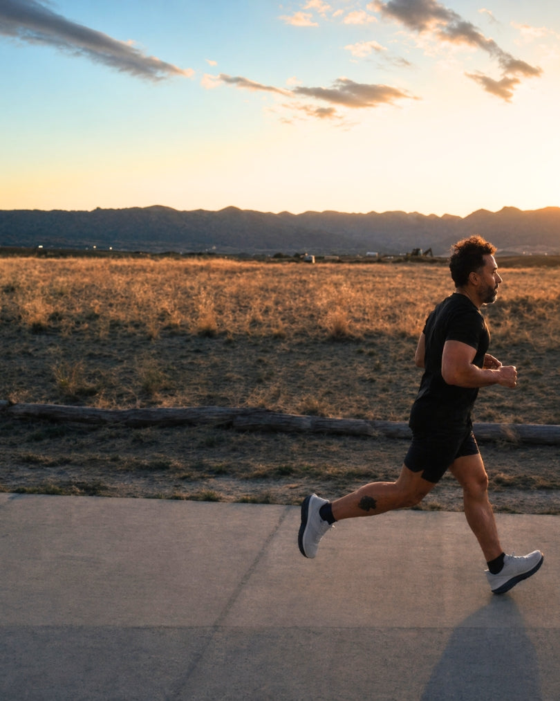 Runner at sunset on a Colorado foothills trail